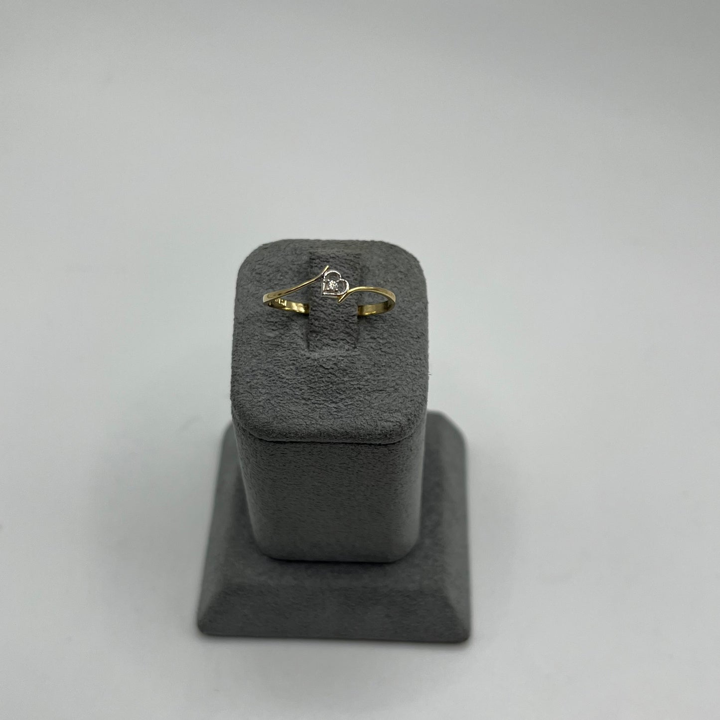 10K Gold ring with a cubic zirconia inside a heart