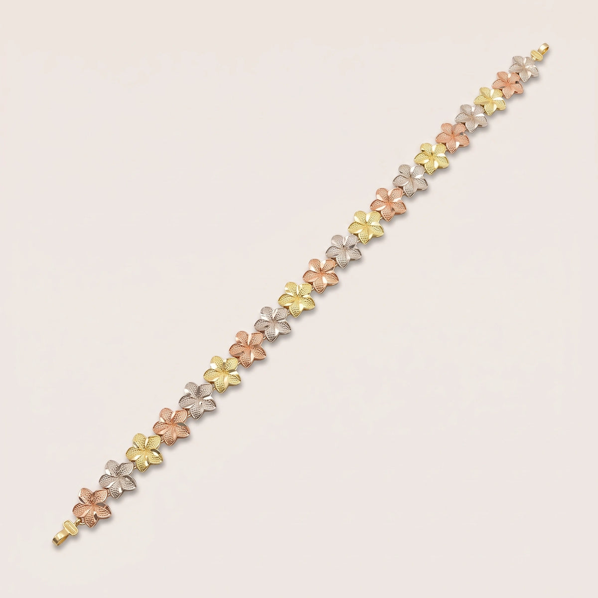 A 10k Gold Small Tri-Color Hibiscus Bracelet with a small, delicate hibiscus design in three vibrant colors.