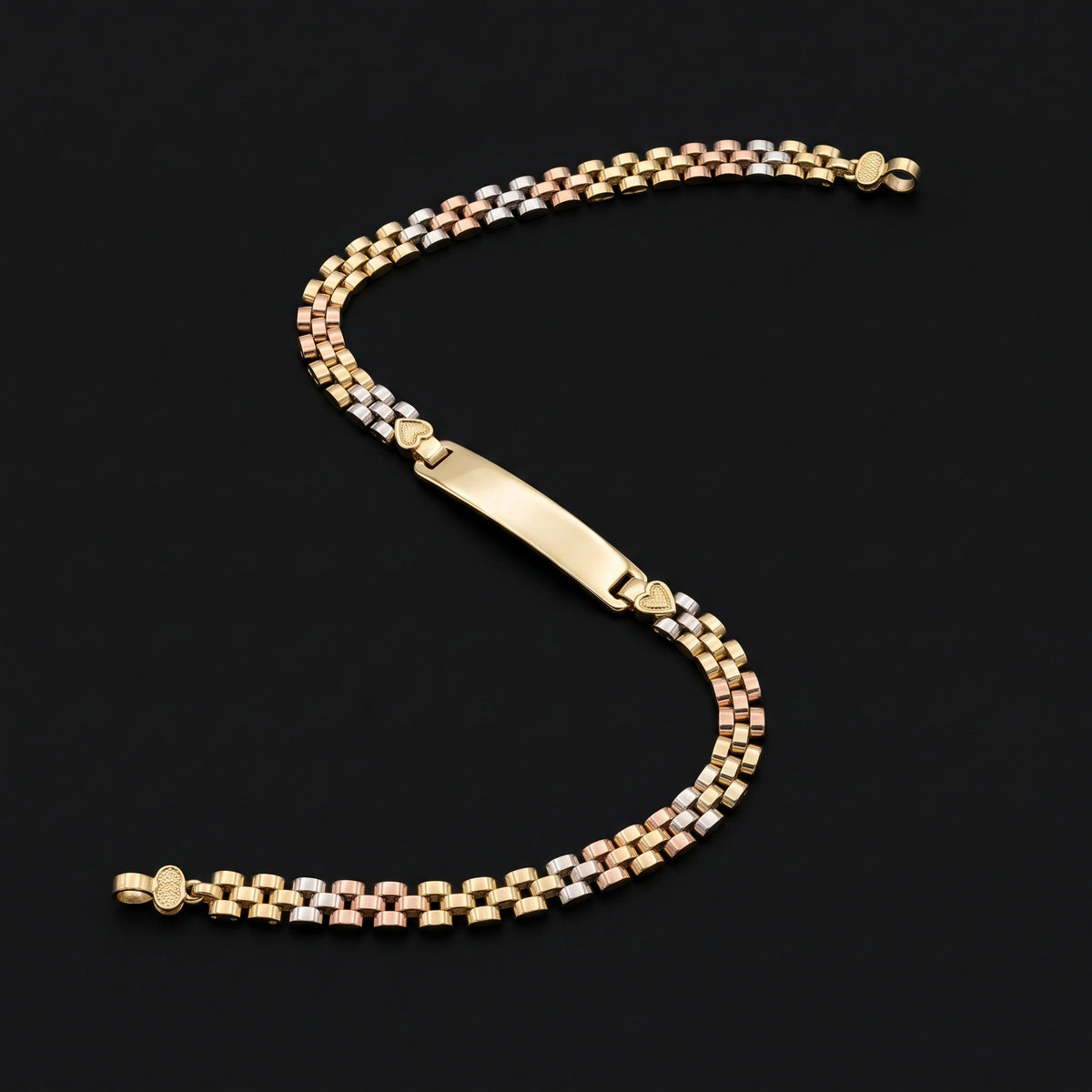 A 14k Gold Solid 4mm Rx Tri -Color Bracelet with a polished yellow gold ID plate, displayed on a solid black background.