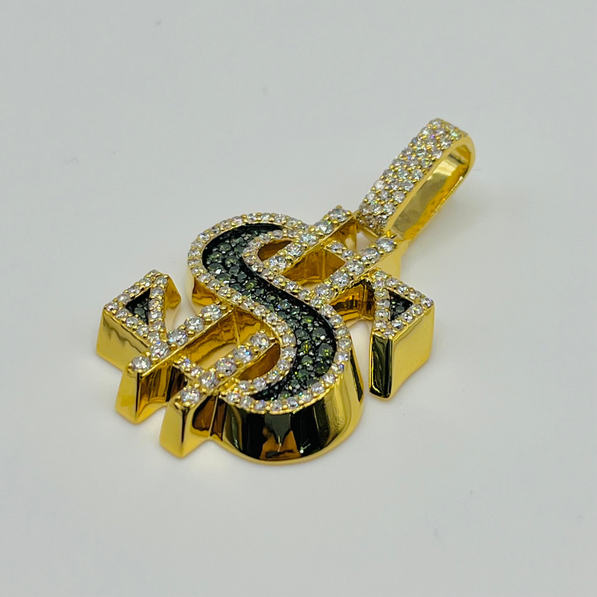 Gold and black dollar sign pendant with diamonds on a white background