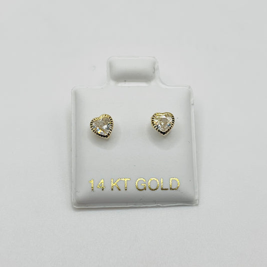 Heart-shaped gold earrings on a 14 KT Gold branded card against a light gray background