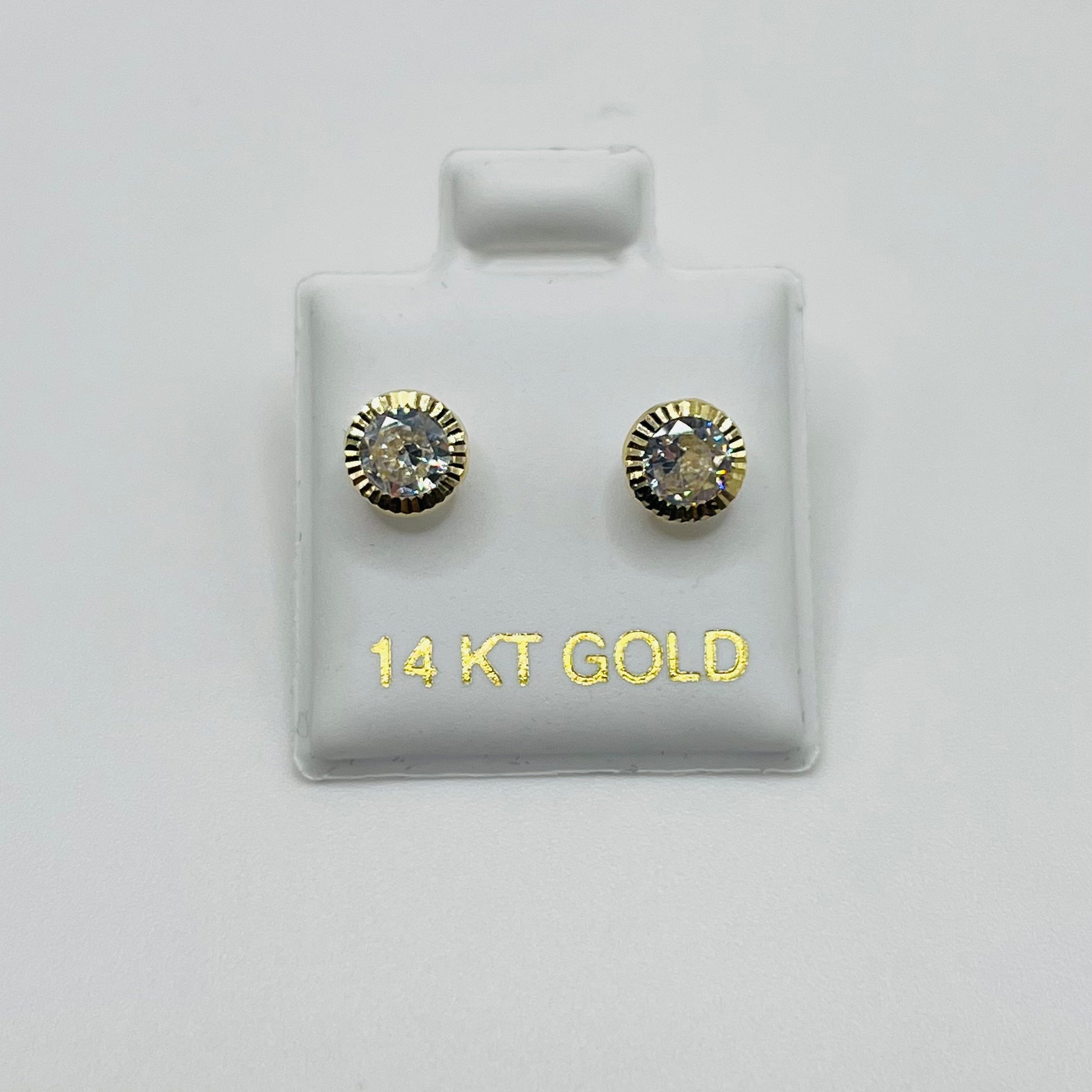 Gold earrings on a display card with '14 KT GOLD' text on a white background