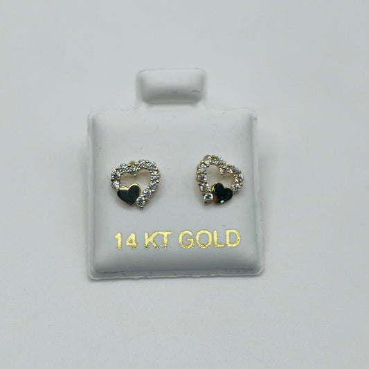 Pair of gold heart-shaped earrings with black centers on a white card labeled '14 KT GOLD'.