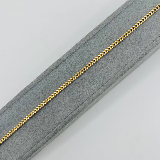 10K gold franco bracelets with diamond cuts on a gray jewelry stand with white background