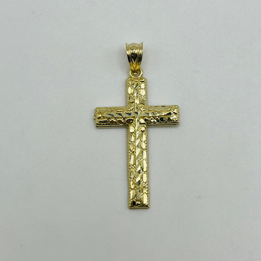 Gold cross pendant on a light gray background