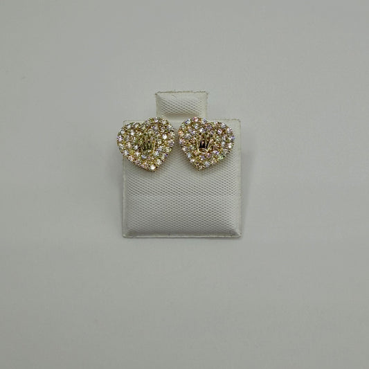Heart-shaped earrings with rhinestones on a gray background