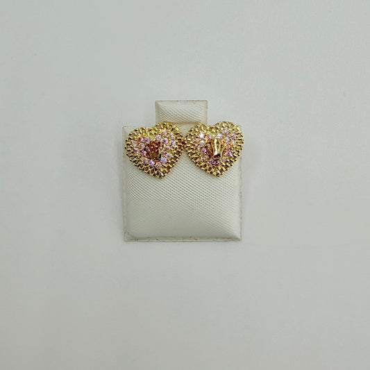 Heart-shaped earrings with gemstones on a white display card against a light gray background