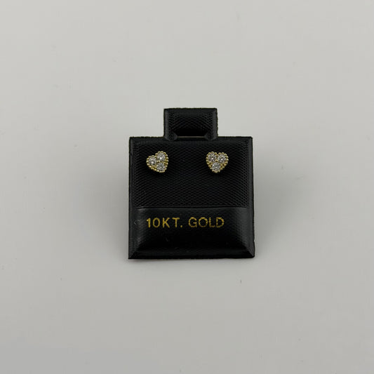 Pair of heart-shaped gold earrings in a black box labeled '10KT. GOLD' on a gray background