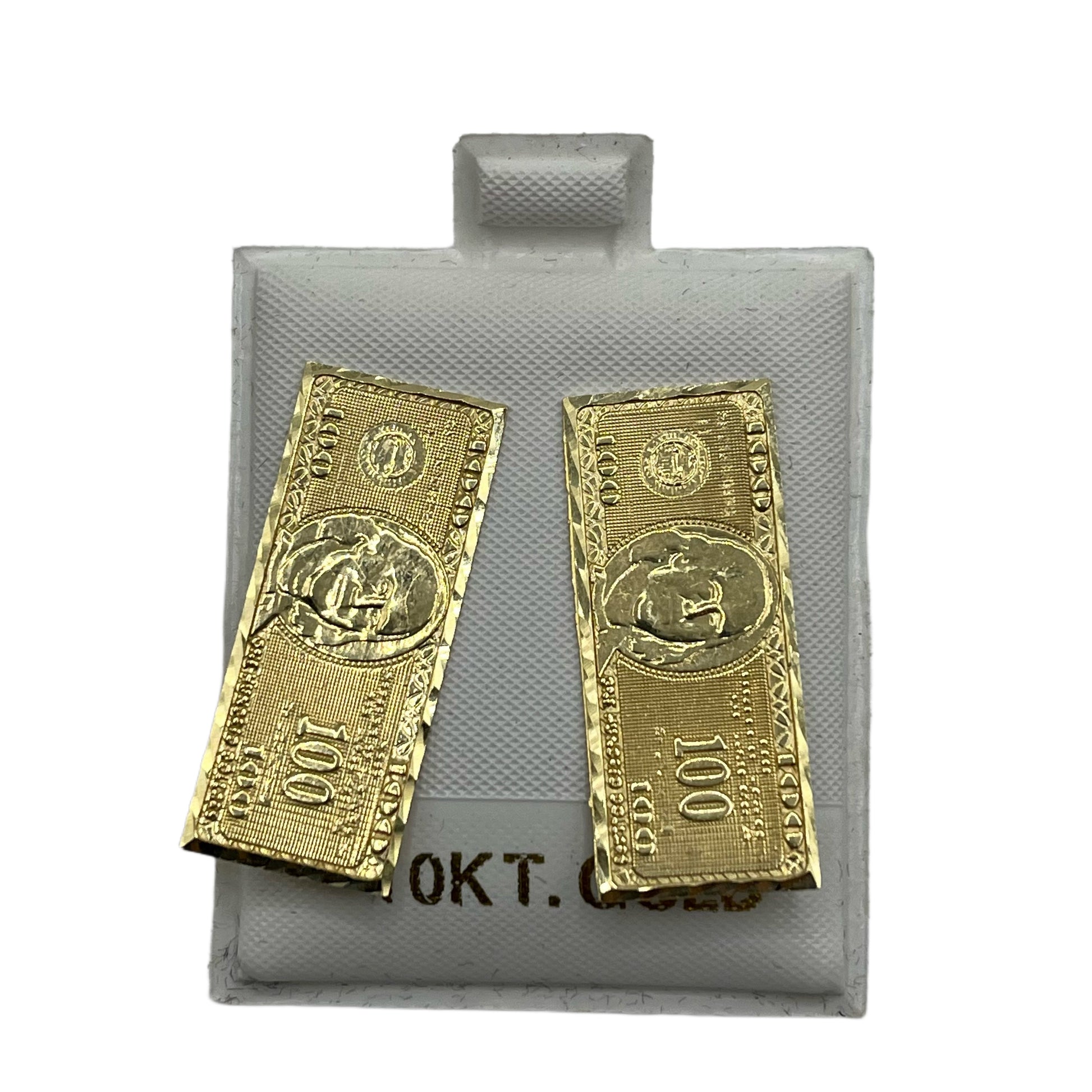 A pair of 10K gold earrings designed to resemble $100 bills, displayed against a grey background.