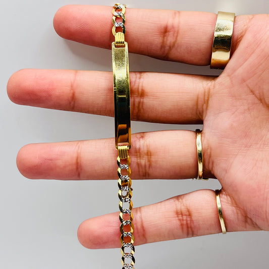 A person's hand displaying a 14k gold ID bracelet with a diamond cut solid 3mm Cuban link and a lobster clasp.
