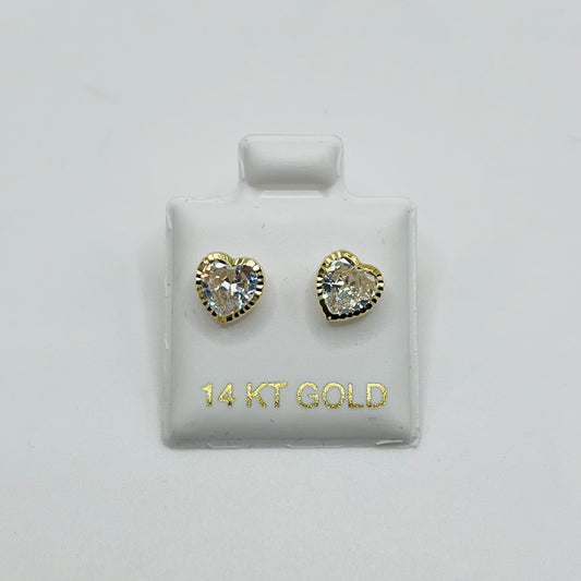 Heart-shaped gold earrings on a display card with '14 KT GOLD' text.