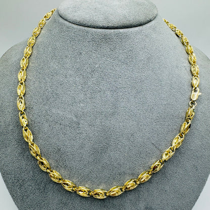 A 10K gold Turkish link chain necklace displayed on a mannequin bust.