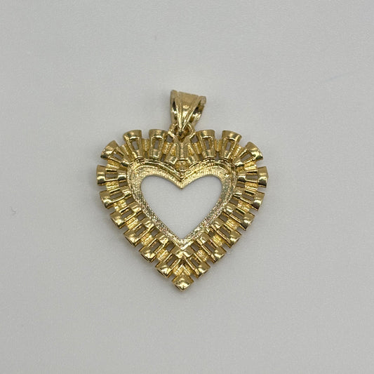 Gold heart-shaped pendant on a gray background