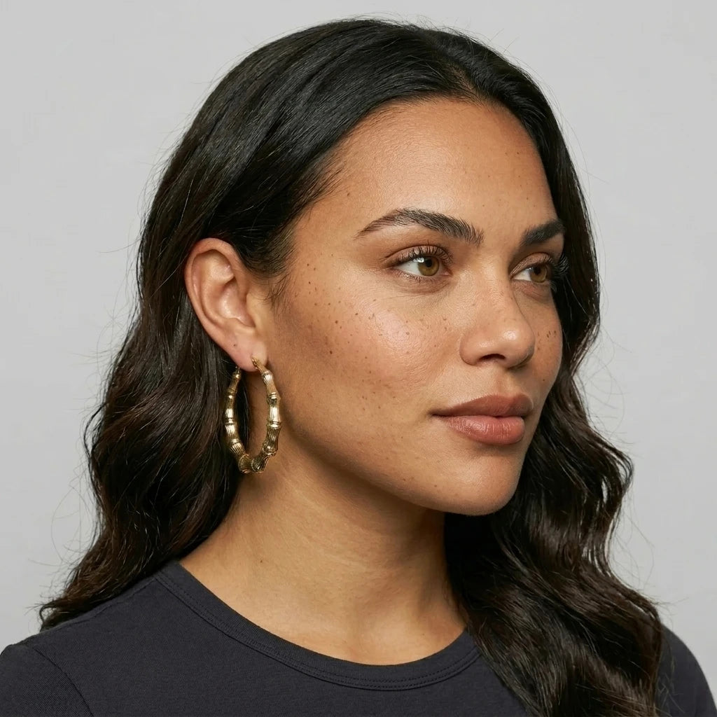 10K Gold Bamboo Hoop Earrings (1.6in) — On Model - Close-up Detail | Generated by Modelize